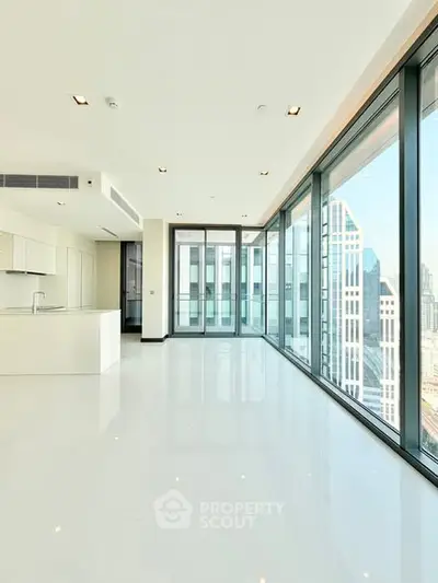 Luxurious modern apartment with floor-to-ceiling windows and stunning city views