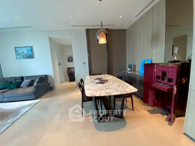 Modern living room with elegant dining area and stylish decor