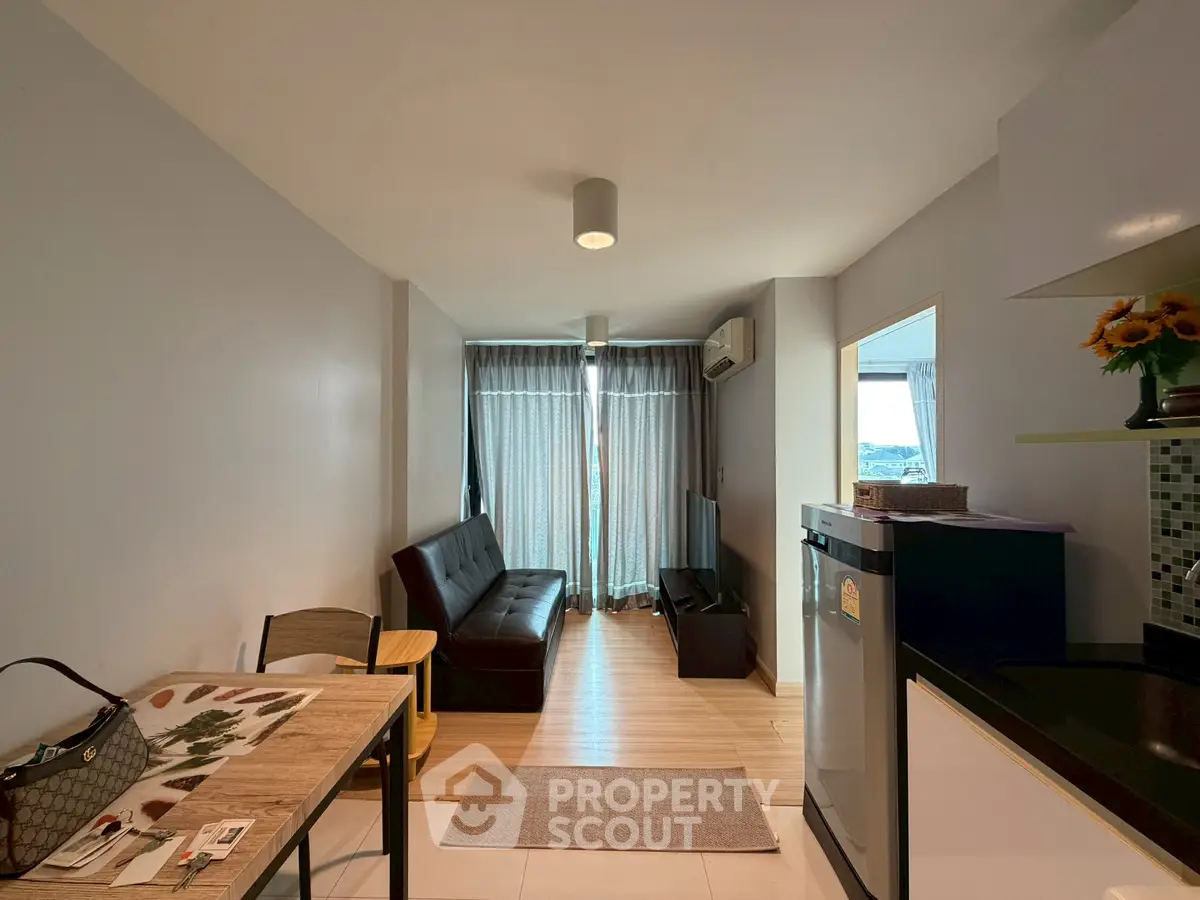 Modern living room with sleek furniture and natural light, perfect for urban living.