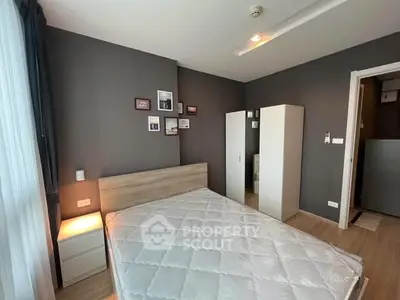 Modern bedroom with stylish decor and ample natural light in a contemporary apartment.