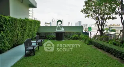 Charming rooftop garden with city views and seating area, perfect for relaxation and outdoor enjoyment.