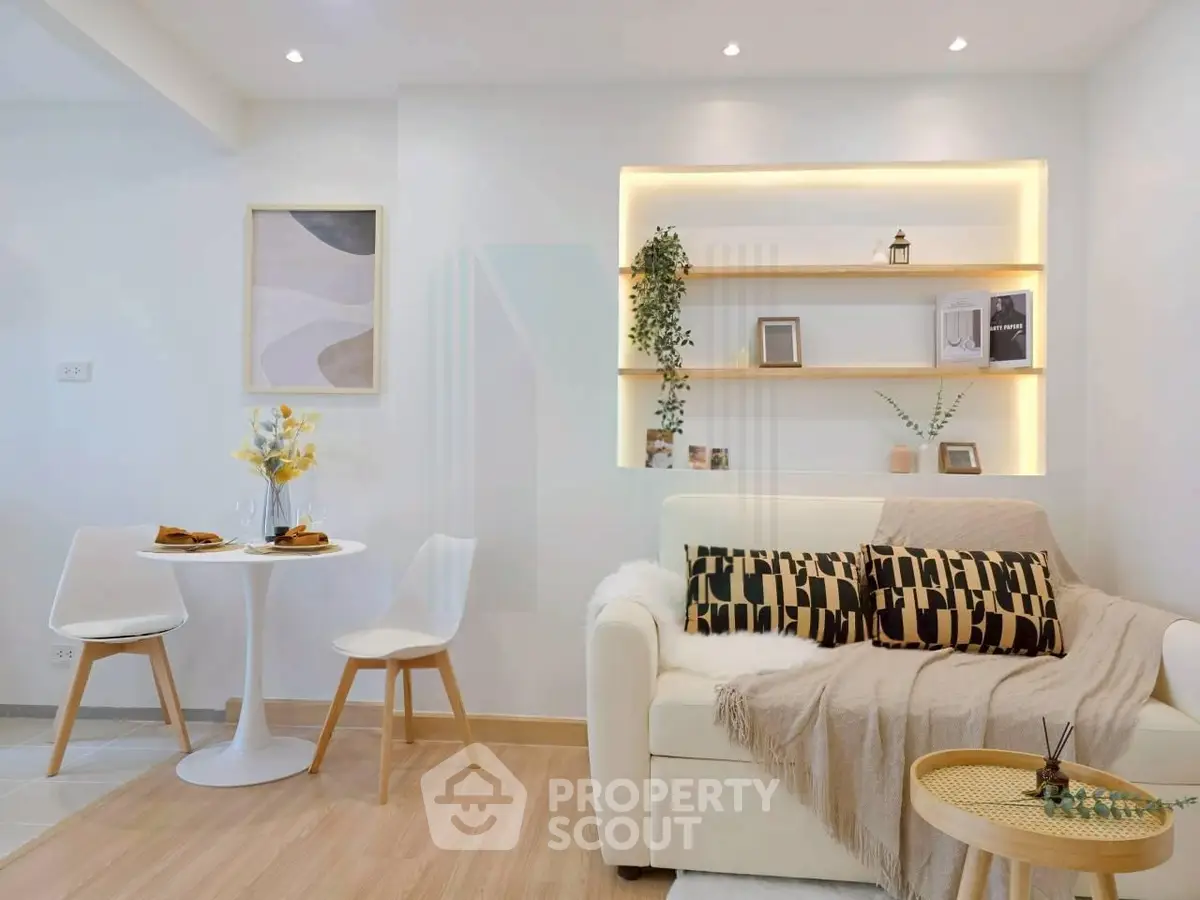 Modern living room with stylish decor and cozy seating area, perfect for relaxation and entertaining.