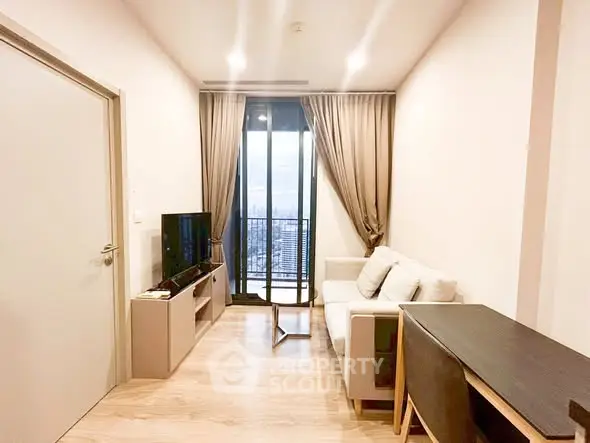 Modern living room with balcony view in high-rise apartment