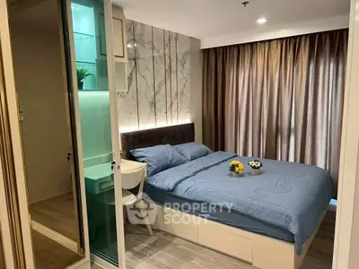Modern bedroom with stylish decor and natural light, featuring a cozy bed and elegant curtains.