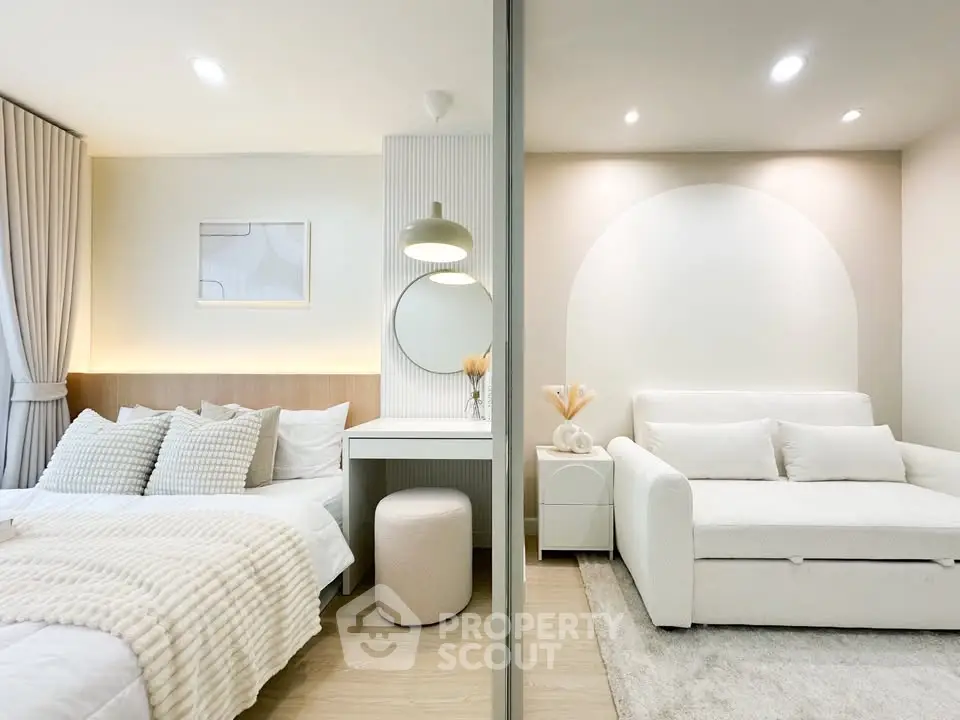 Modern studio apartment with cozy bedroom and stylish living area, featuring neutral tones and elegant decor.