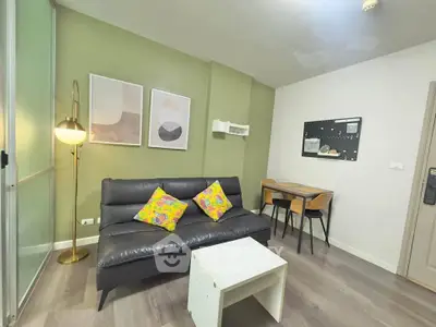 Modern living room with stylish decor and cozy seating area in a contemporary apartment.