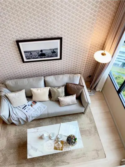 Stylish living room with modern decor and large window view