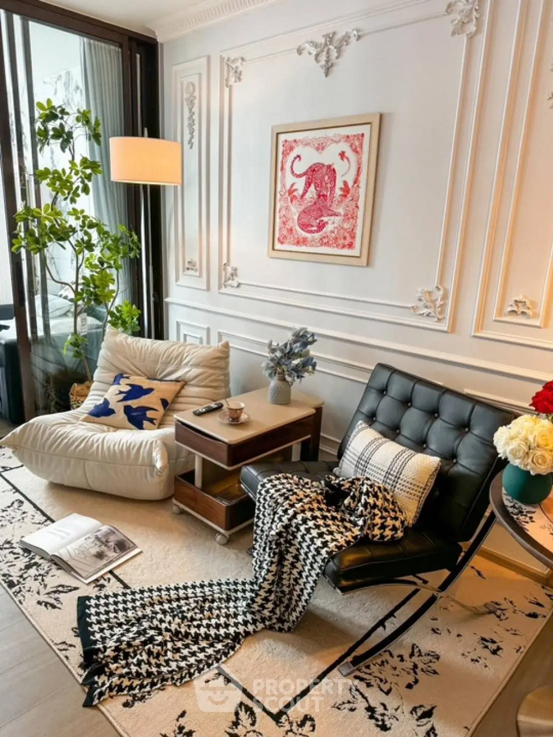 Chic living room with elegant decor, plush seating, and stylish wall art, perfect for modern comfort.