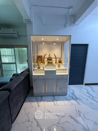 Elegant living room with marble flooring and built-in display cabinet