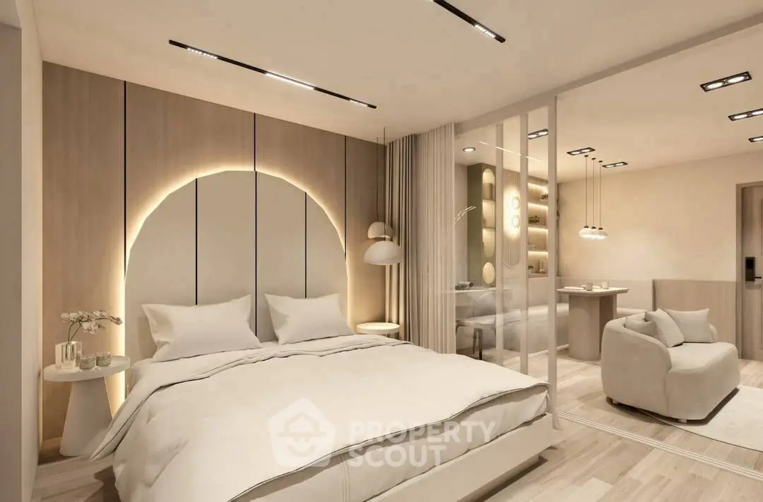 Luxurious modern bedroom with elegant lighting and cozy seating area
