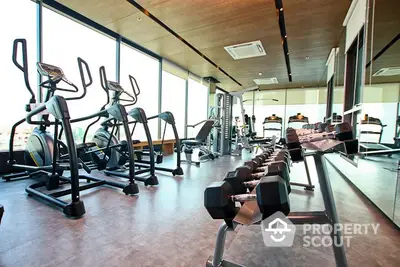 Modern gym with state-of-the-art equipment and panoramic windows.