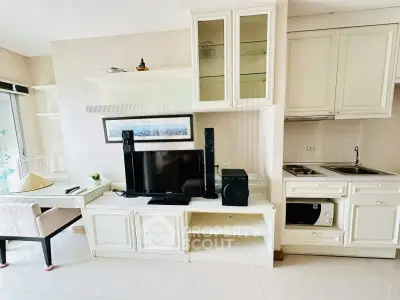 Chic modern living room with sleek white cabinetry and entertainment center
