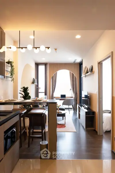 Modern open-layout living room with stylish decor and natural light