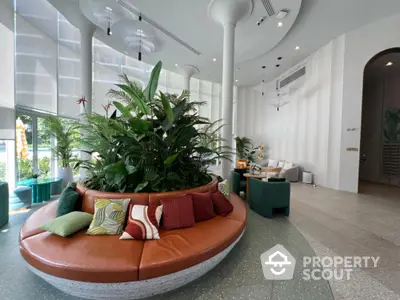 Stylish modern living room with circular seating and lush indoor plants