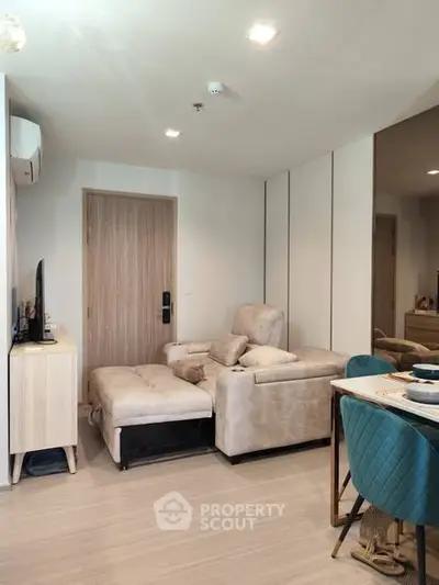 Modern living room with cozy beige sofa and stylish dining area
