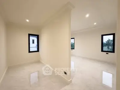 Spacious modern interior with large windows and glossy floors, perfect for customization.