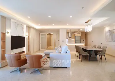 Luxurious open-plan living room with modern furniture and elegant lighting