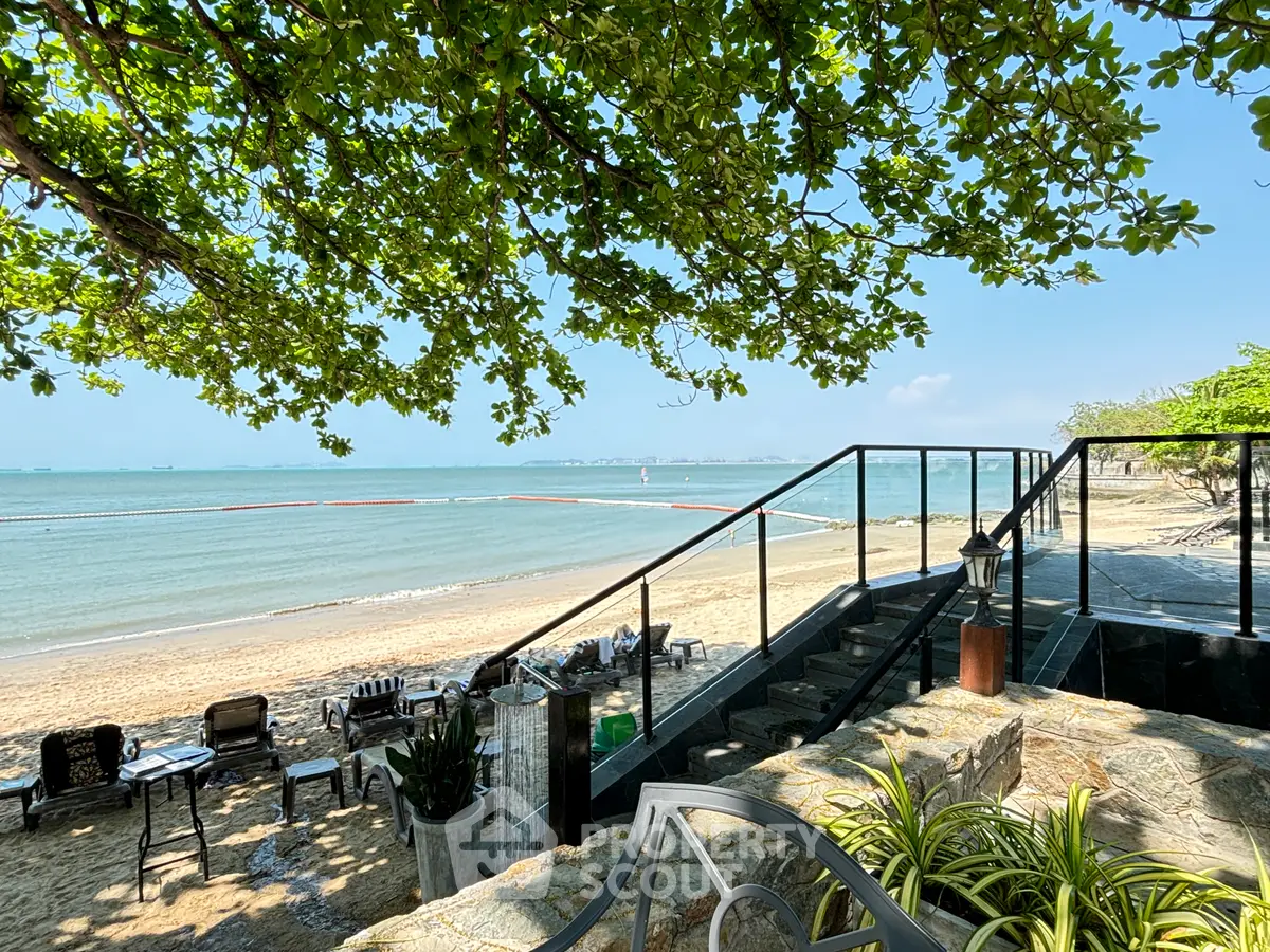 Stunning beachfront property with direct access to sandy shores and ocean views, perfect for luxury living or vacation.
