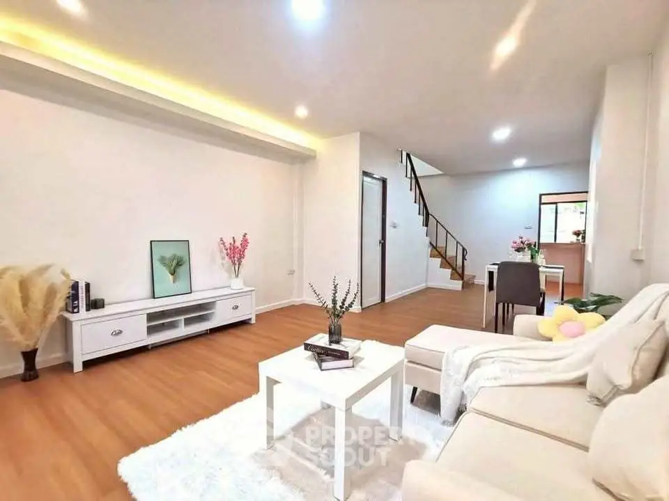 Spacious modern living room with elegant decor and wooden flooring