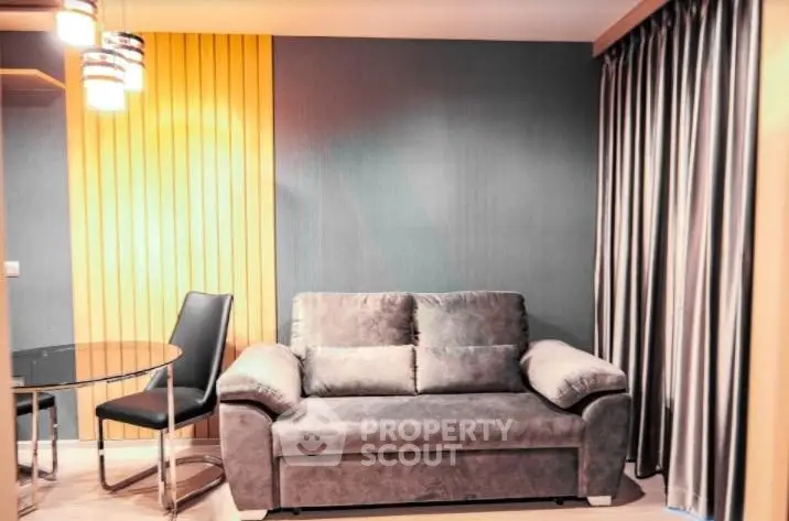 Modern living room with stylish sofa and dining area in contemporary apartment.