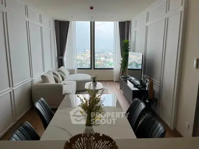 Modern living room with panoramic city view and elegant decor