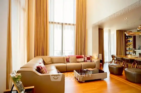 Luxurious living room with high ceilings and elegant decor in modern apartment