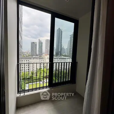Modern balcony with city skyline view in high-rise apartment
