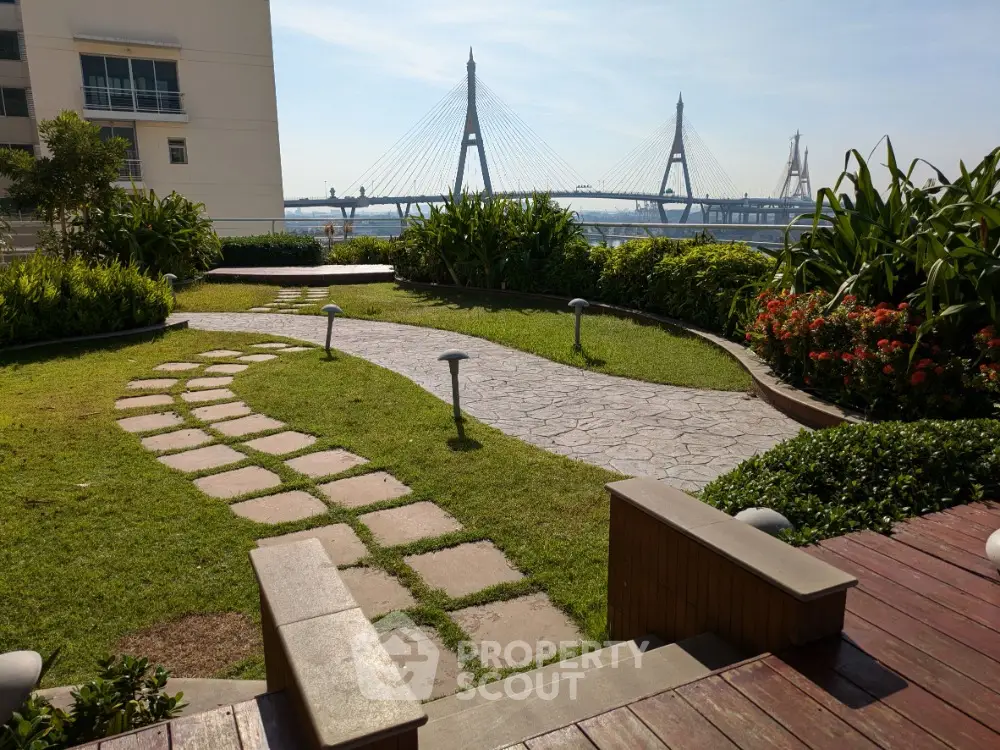 Stunning garden with scenic bridge view, perfect for relaxation and outdoor enjoyment.