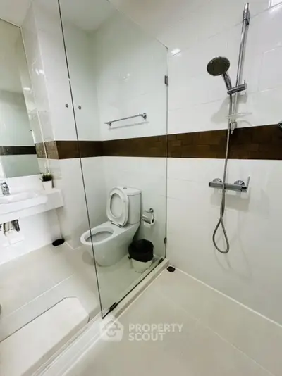 Modern bathroom with glass shower and sleek fixtures