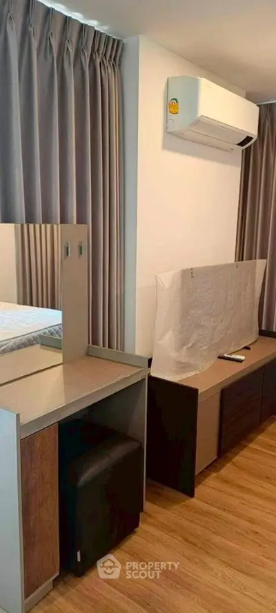 Modern bedroom with air conditioning and stylish furniture in a cozy apartment.