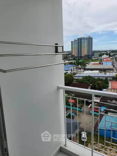 High-rise balcony with city view, perfect for urban living.