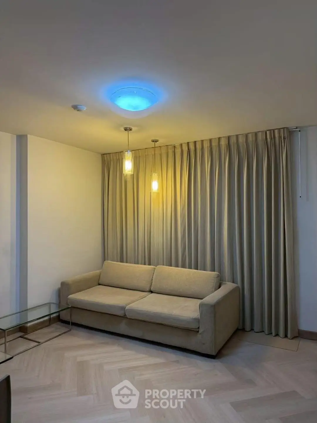 Cozy living room with modern sofa and elegant lighting