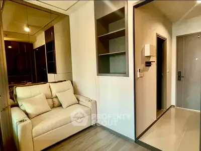 Modern living room with cozy sofa and sleek design, perfect for urban living.
