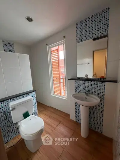 Modern bathroom with stylish tile accents and natural light