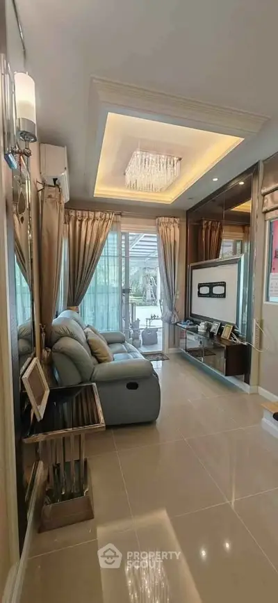 Luxurious living room with elegant chandelier and modern decor