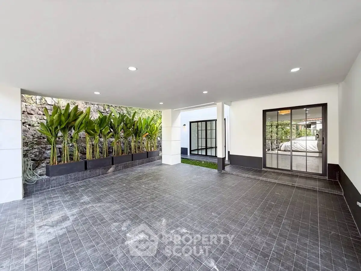 Spacious modern parking area with sleek design and lush greenery