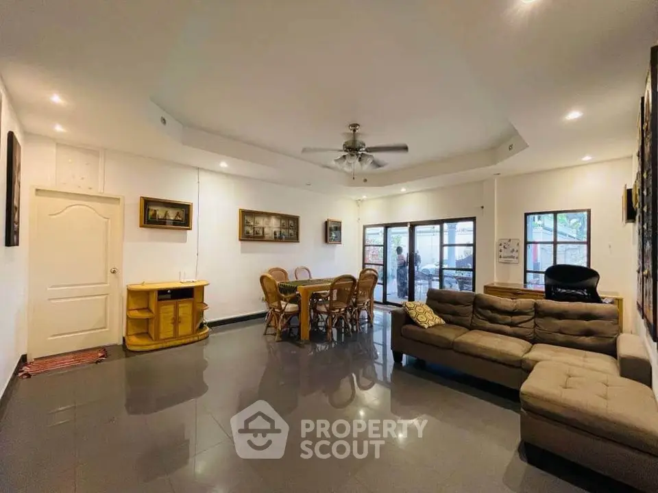 Spacious living room with modern furniture and large windows for natural light.