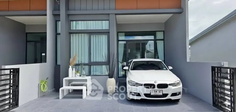 Modern home exterior with sleek design and carport showcasing contemporary architecture.