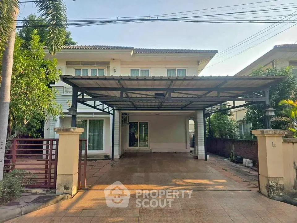 Spacious two-story house with large driveway and covered parking in a serene neighborhood.