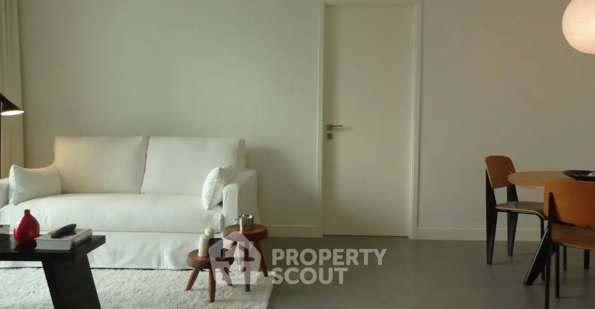 Modern living room with white sofa and minimalist decor