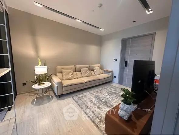 Modern living room with cozy beige sofa and stylish decor