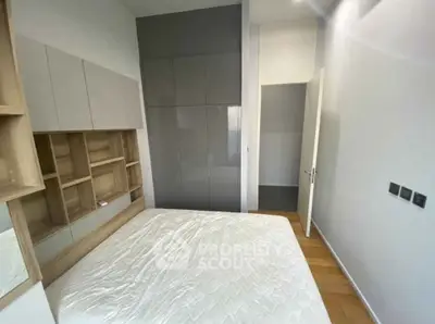 Modern bedroom with sleek built-in storage and minimalist design