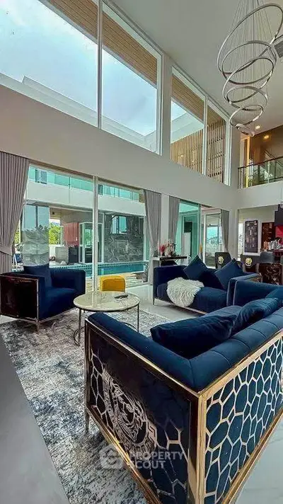 Luxurious modern living room with high ceilings and elegant decor