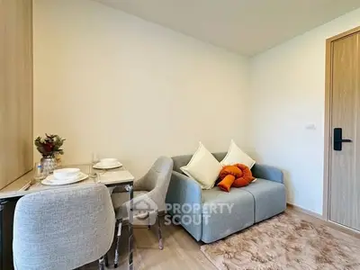 Cozy living room with modern furniture and dining area in compact space