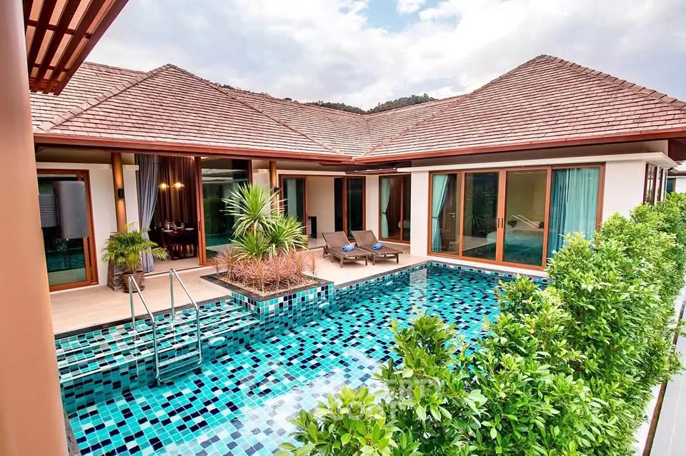 Luxurious villa with private pool and lush greenery, perfect for serene living.
