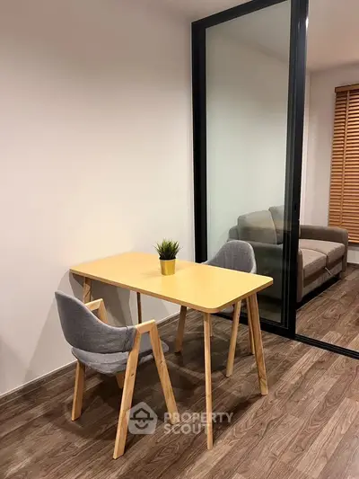 Modern interior with stylish dining area and cozy living room in open layout apartment.