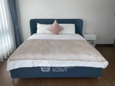 Modern bedroom with stylish bed and elegant decor in a bright apartment.