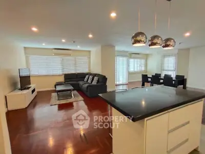 Spacious modern living room with open kitchen and stylish decor