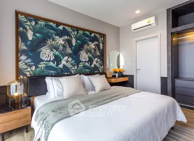 Luxurious bedroom with modern decor and tropical accent wall