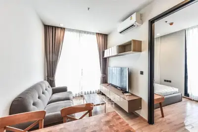 Modern living room with stylish furniture and natural light in a contemporary apartment.